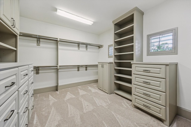 12710 Pebblebrook Dr, Houston, TX 77024 - walk in closet featuring light colored carpet