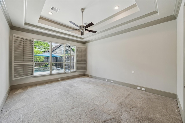 12710 Pebblebrook Dr, Houston, TX 77024 - carpeted empty room with ornamental molding, a tray ceiling, ceiling fan, baseboards, and recessed lighting