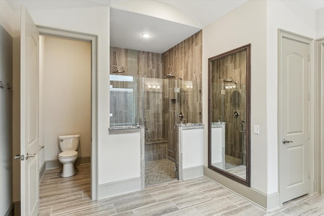 12710 Pebblebrook Dr, Houston, TX 77024 - full bathroom with toilet, a shower stall, and wood tiled floors
