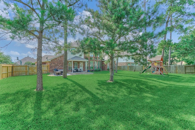 25322 Metzler Creek Dr, Spring, TX 77389 - view of yard with a playground and a patio area