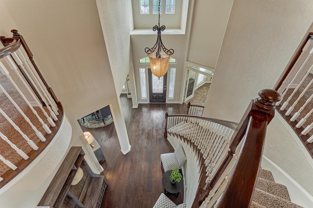 25322 Metzler Creek Dr, Spring, TX 77389 - foyer entrance featuring a towering ceiling, wood finished floors, stairs, baseboards, and a textured wall
