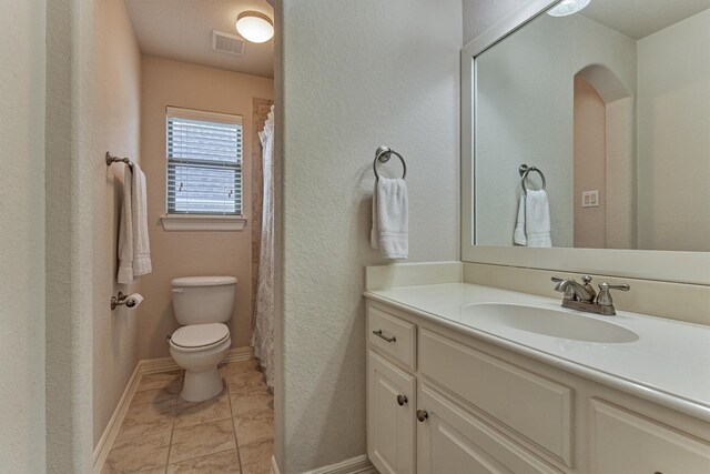 25322 Metzler Creek Dr, Spring, TX 77389 - full bath featuring toilet, vanity, tile patterned floors, and a textured wall