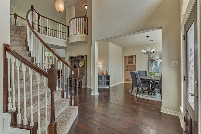 25322 Metzler Creek Dr, Spring, TX 77389 - entrance foyer with wood finished floors, baseboards, stairs, a high ceiling, and a chandelier