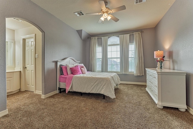 25322 Metzler Creek Dr, Spring, TX 77389 - bedroom with arched walkways, light colored carpet, baseboards, and ceiling fan