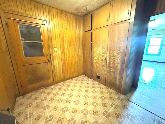 605 5th St, Louise, TX 77455 - doorway with wood walls and light flooring