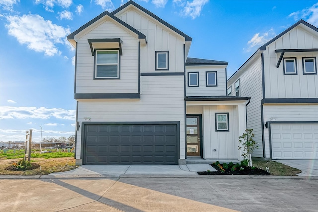 8918 Grovner Pl, Houston, TX 77055 - modern home with board and batten siding, a garage, and driveway