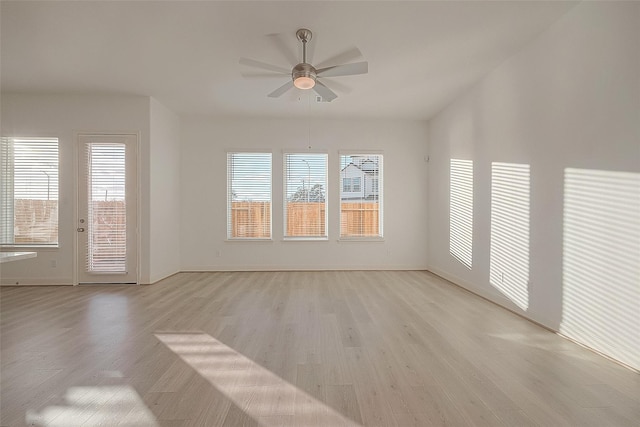 8918 Grovner Pl, Houston, TX 77055 - unfurnished living room with light wood-type flooring, ceiling fan, and baseboards