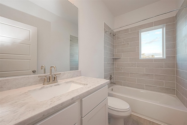 8918 Grovner Pl, Houston, TX 77055 - bathroom featuring toilet, vanity, tub / shower combination, and wood finished floors