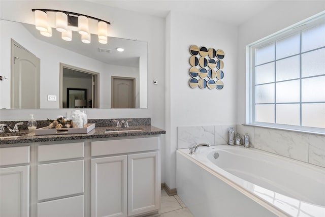 204 Shoreview Dr, Conroe, TX 77303 - bathroom with double vanity, a bath, and marble look tile flooring