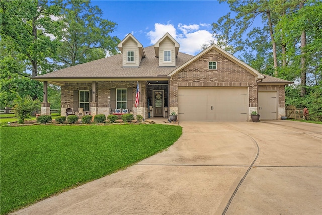 28026 Chuckwagon Trl, Magnolia, TX 77355 - view of front of home featuring brick siding, driveway, a garage, and a shingled roof