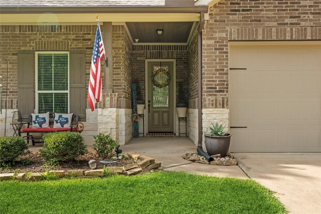 28026 Chuckwagon Trl, Magnolia, TX 77355 - view of exterior entry with an attached garage, brick siding, and driveway