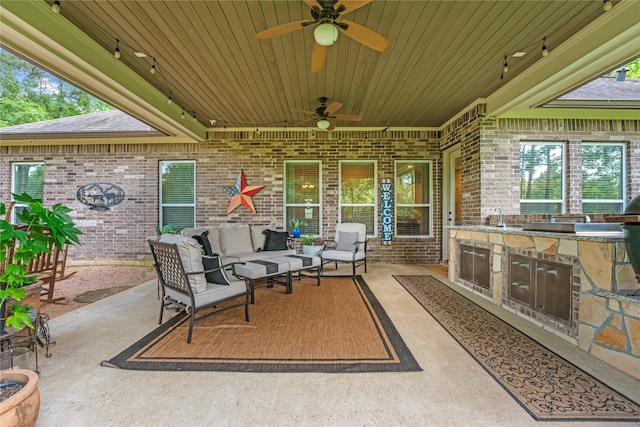 28026 Chuckwagon Trl, Magnolia, TX 77355 - view of patio with exterior kitchen, an outdoor hangout area, ceiling fan, and a sink