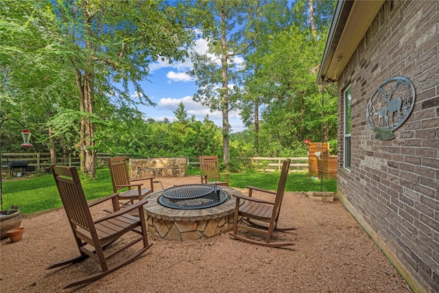 28026 Chuckwagon Trl, Magnolia, TX 77355 - view of patio featuring a fire pit