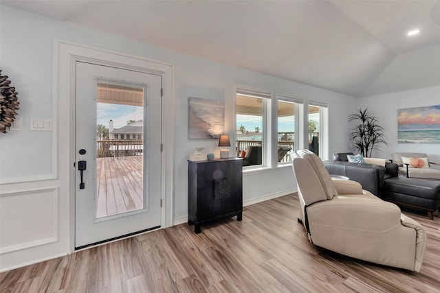 1427 Bamboo Dr, Tiki Island, TX 77554 - living room featuring wood finished floors and vaulted ceiling