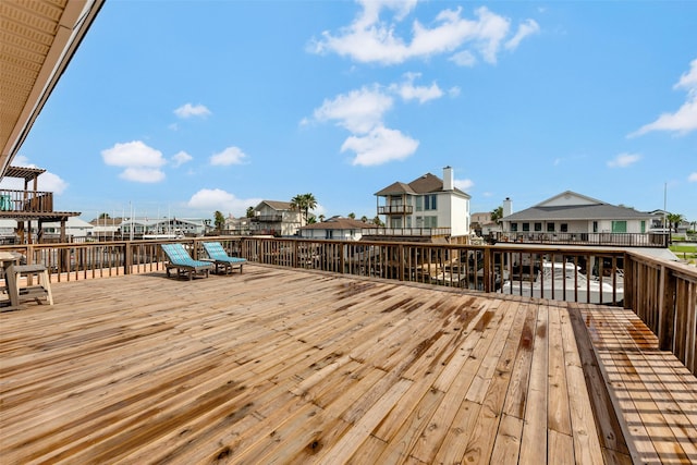 1427 Bamboo Dr, Tiki Island, TX 77554 - wooden deck featuring a residential view