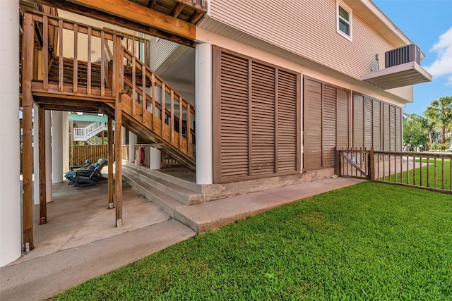 1427 Bamboo Dr, Tiki Island, TX 77554 - view of side of property with stairway and a patio area