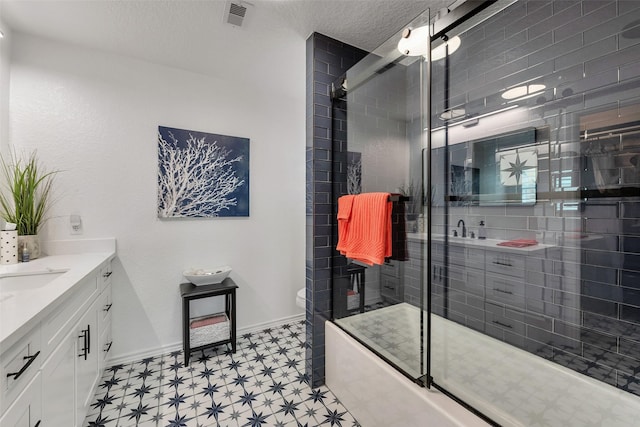 1427 Bamboo Dr, Tiki Island, TX 77554 - full bath featuring vanity, tile patterned floors, toilet, a shower with door, and baseboards