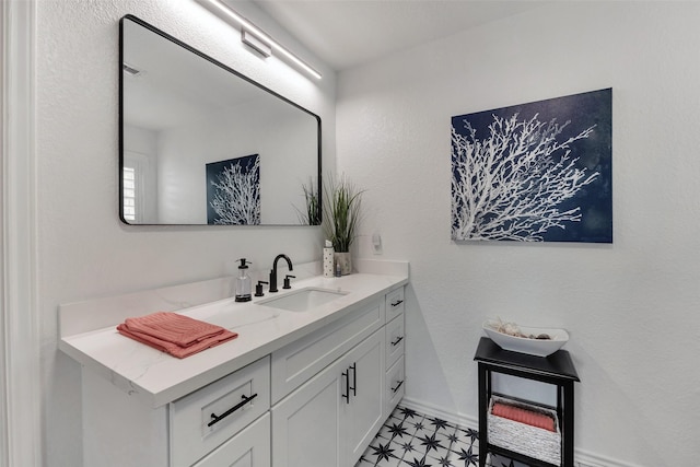 1427 Bamboo Dr, Tiki Island, TX 77554 - bathroom featuring vanity and baseboards