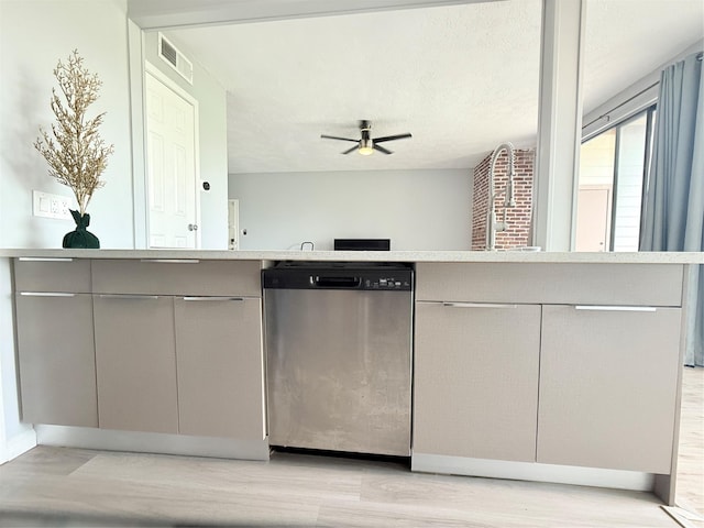 8149 Sands Point Dr Unit 113, Houston, TX 77036 - kitchen featuring dishwasher, light countertops, gray cabinets, and a ceiling fan