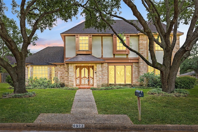 4923 Bradstone Ct, Houston, TX 77084 - view of front of home featuring a shingled roof, a front yard, and brick siding