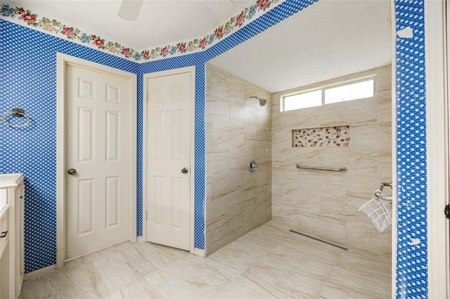 4923 Bradstone Ct, Houston, TX 77084 - full bath featuring a tile shower and a textured ceiling