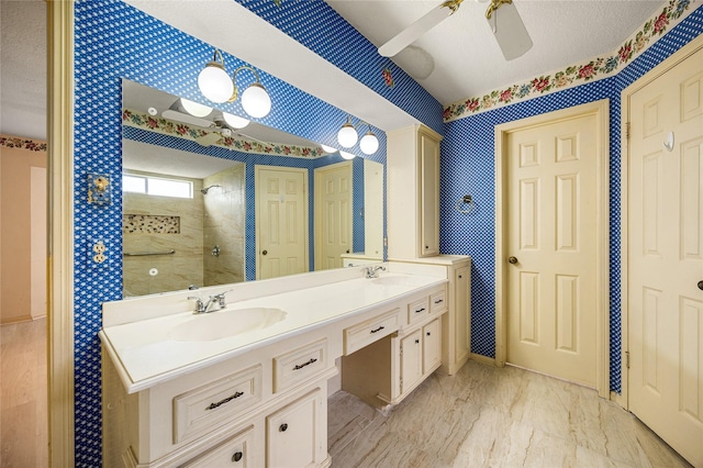 4923 Bradstone Ct, Houston, TX 77084 - bathroom featuring wallpapered walls, double vanity, tiled shower, and a ceiling fan