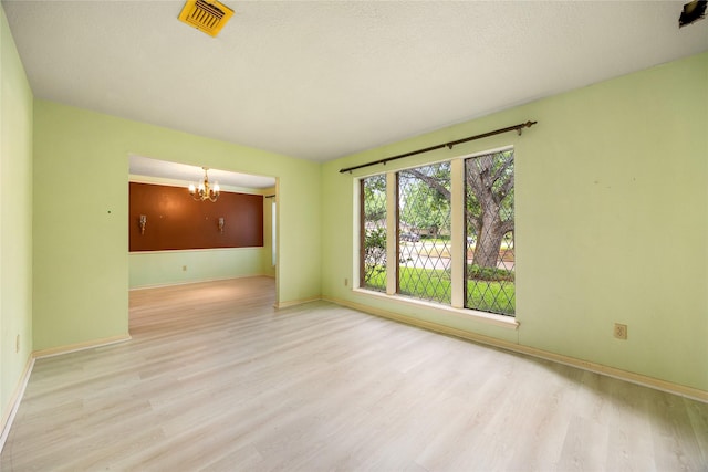 4923 Bradstone Ct, Houston, TX 77084 - unfurnished room with wood finished floors, a chandelier, and baseboards