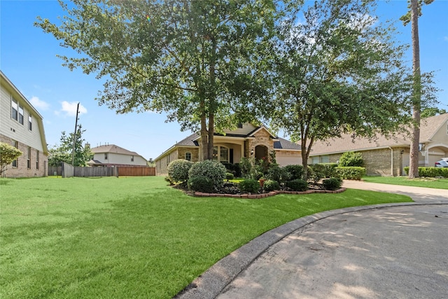 7 Fraiser Fir Pl, Spring, TX 77389 - view of front of property with driveway, an attached garage, and brick siding