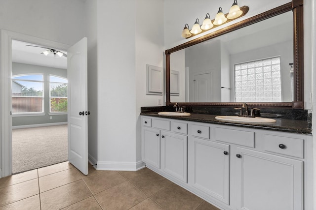 7 Fraiser Fir Pl, Spring, TX 77389 - bathroom with double vanity, baseboards, tile patterned flooring, and ceiling fan