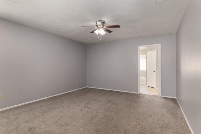 13402 Piney Oaks Dr, Houston, TX 77065 - carpeted spare room featuring a ceiling fan, a textured ceiling, and baseboards