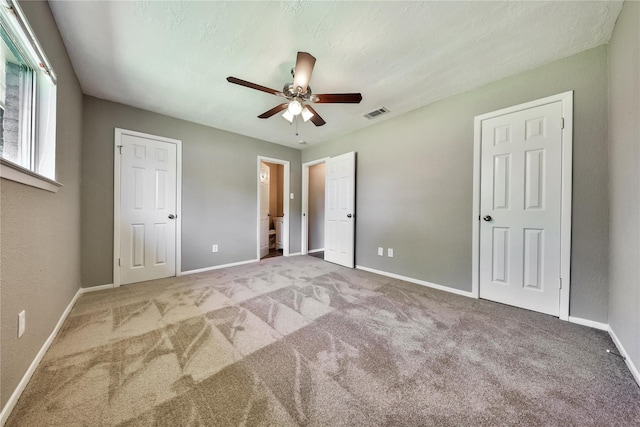 9814 Appleridge Dr, Houston, TX 77070 - unfurnished bedroom with carpet floors, baseboards, ceiling fan, and connected bathroom