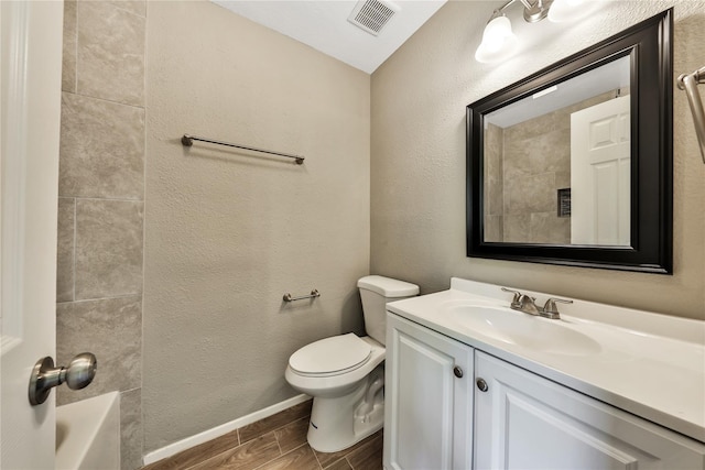 9814 Appleridge Dr, Houston, TX 77070 - full bath with vanity, toilet, wood tiled floors, baseboards, and tub / shower combination