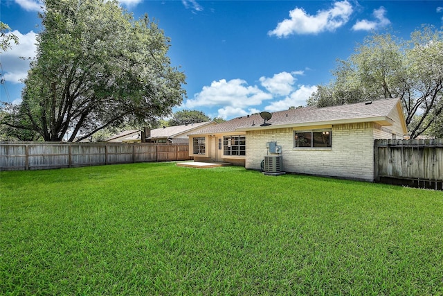 9814 Appleridge Dr, Houston, TX 77070 - rear view of property with brick siding, cooling unit, a patio, and a shingled roof
