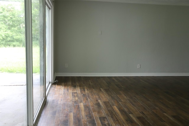 5952 Moonstone St, Port Arthur, TX 77640 - spare room with dark wood finished floors and baseboards