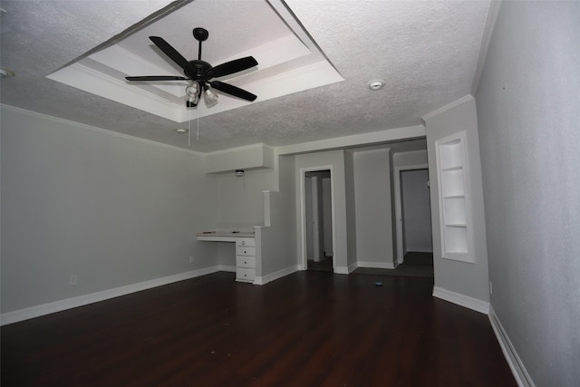 5952 Moonstone St, Port Arthur, TX 77640 - unfurnished living room featuring wood finished floors, a textured ceiling, a ceiling fan, baseboards, and a raised ceiling