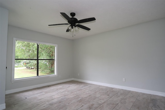 5952 Moonstone St, Port Arthur, TX 77640 - spare room with light wood-type flooring, baseboards, and ceiling fan