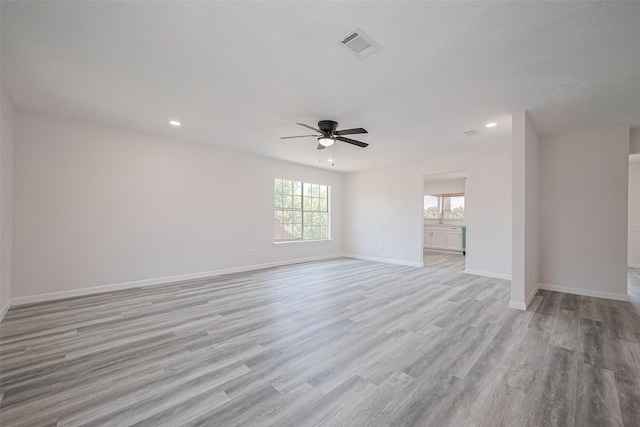 413 E Castle Harbour Dr W, Friendswood, TX 77546 - empty room featuring ceiling fan, light wood finished floors, baseboards, and recessed lighting