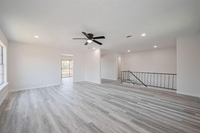413 E Castle Harbour Dr W, Friendswood, TX 77546 - spare room with light wood-type flooring, recessed lighting, a ceiling fan, and baseboards