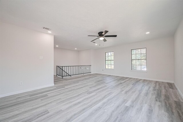413 E Castle Harbour Dr W, Friendswood, TX 77546 - empty room featuring light wood-style flooring, a ceiling fan, recessed lighting, and baseboards