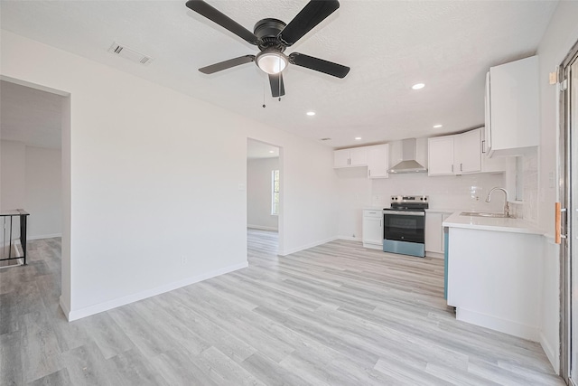 413 E Castle Harbour Dr W, Friendswood, TX 77546 - unfurnished living room with a sink, light wood-style flooring, ceiling fan, baseboards, and recessed lighting