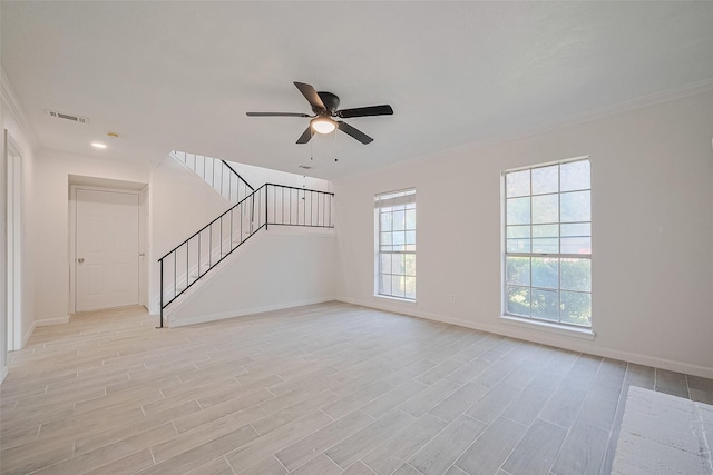 413 E Castle Harbour Dr W, Friendswood, TX 77546 - unfurnished living room featuring crown molding, stairs, ceiling fan, and baseboards