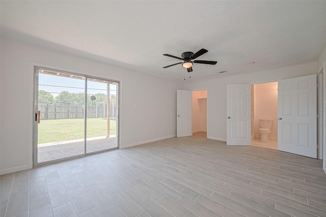 413 E Castle Harbour Dr W, Friendswood, TX 77546 - unfurnished bedroom with access to outside, baseboards, connected bathroom, light wood-style flooring, and a ceiling fan