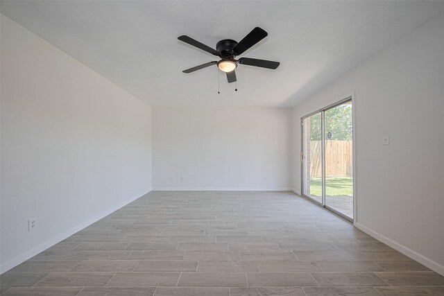 413 E Castle Harbour Dr W, Friendswood, TX 77546 - empty room featuring wood finished floors, a ceiling fan, and baseboards