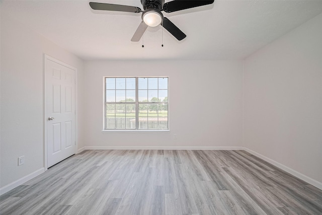 413 E Castle Harbour Dr W, Friendswood, TX 77546 - empty room featuring wood finished floors, baseboards, and a ceiling fan