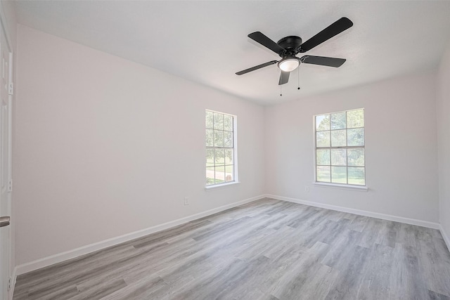 413 E Castle Harbour Dr W, Friendswood, TX 77546 - unfurnished room featuring wood finished floors, baseboards, and a ceiling fan