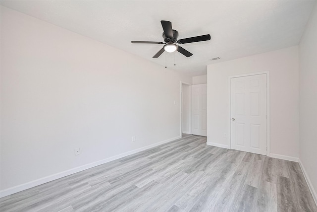 413 E Castle Harbour Dr W, Friendswood, TX 77546 - unfurnished room with light wood-type flooring, baseboards, and ceiling fan