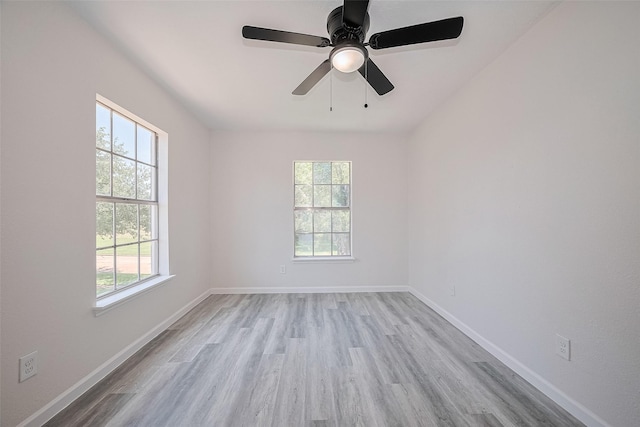 413 E Castle Harbour Dr W, Friendswood, TX 77546 - spare room featuring wood finished floors, baseboards, and ceiling fan