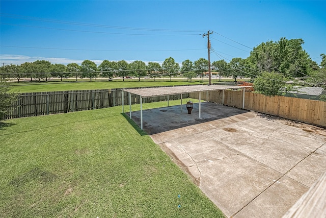 413 E Castle Harbour Dr W, Friendswood, TX 77546 - view of yard with a detached carport, a patio, and concrete driveway