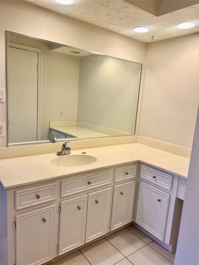 6523 Coral Ridge Rd, Houston, TX 77069 - bathroom featuring vanity, tile patterned floors, and a textured ceiling