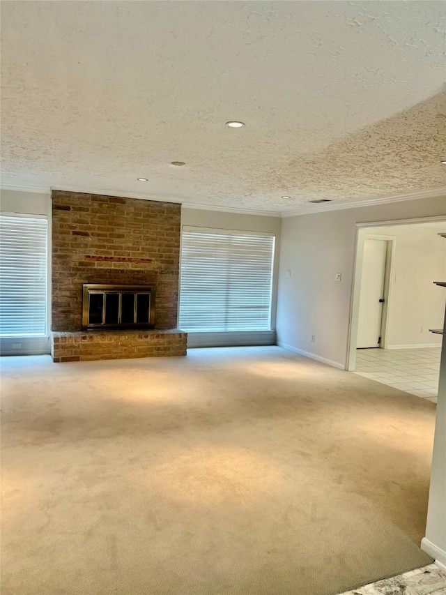 6523 Coral Ridge Rd, Houston, TX 77069 - unfurnished living room with carpet flooring, crown molding, a textured ceiling, a brick fireplace, and baseboards
